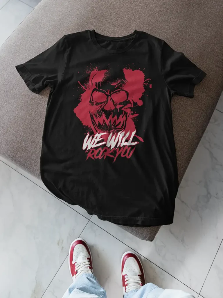 a black t-shirt with a graphic print design showing a red head and words: we will rock you
